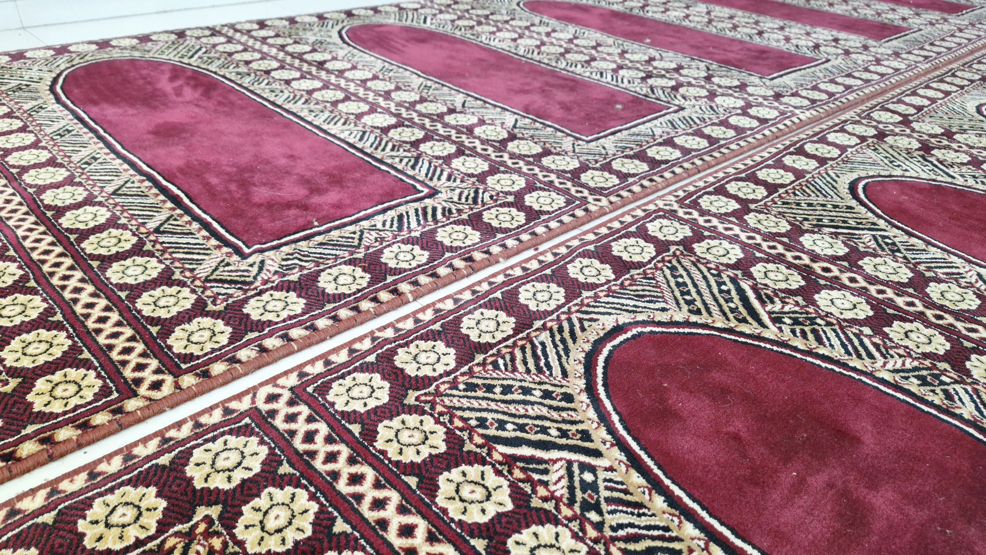 The appearance red prayer mat on the mosque. Sajadah.